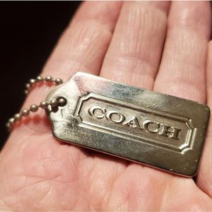 Coach metal hang tag